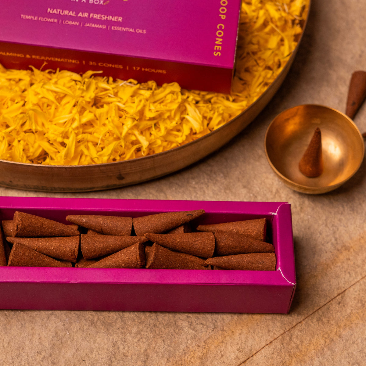 Incense cones with a yellow incense burner