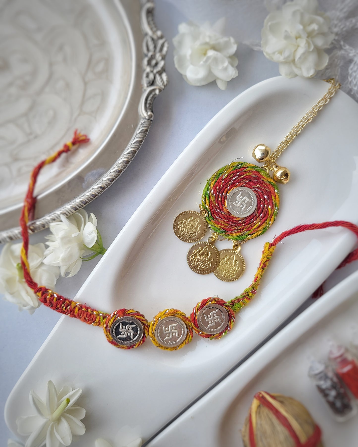 Swastik Silver Three Coin Rakhi