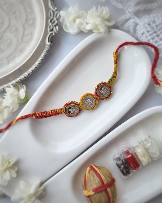 Swastik Silver Three Coin Rakhi