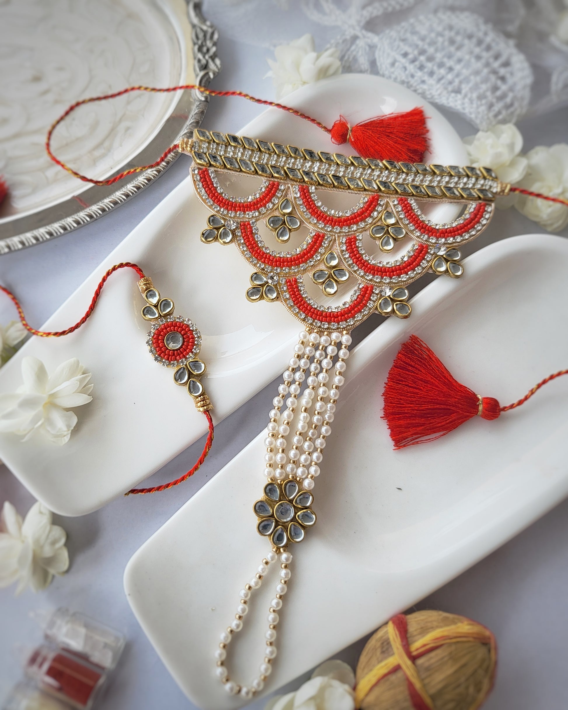 Bhabhi Hathful Rakhi and Red Pearl Brother Rakhi Set