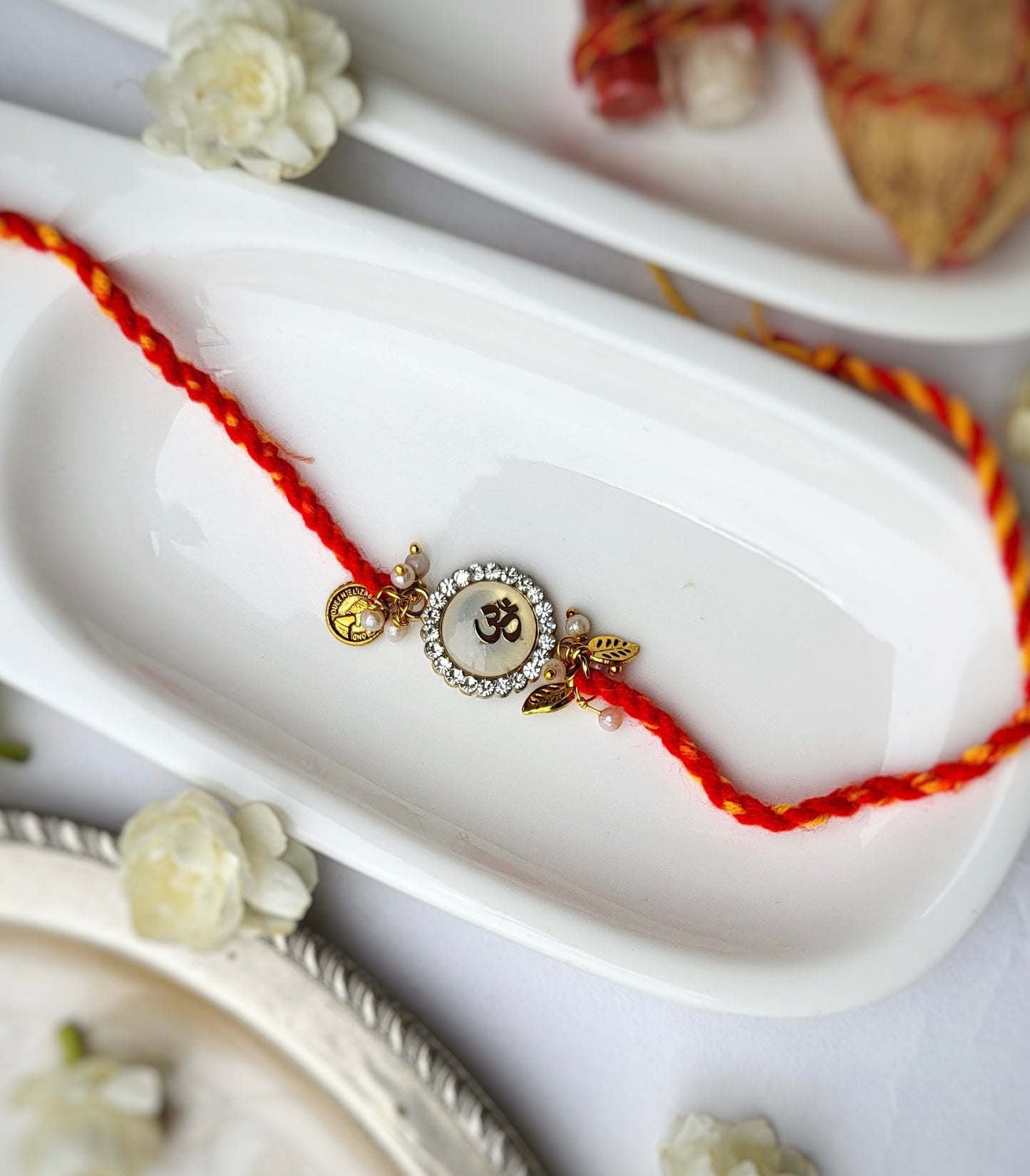Brass-cut Om on White Stone