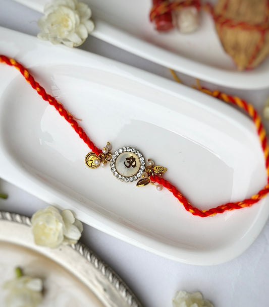 Brass-cut Om on White Stone